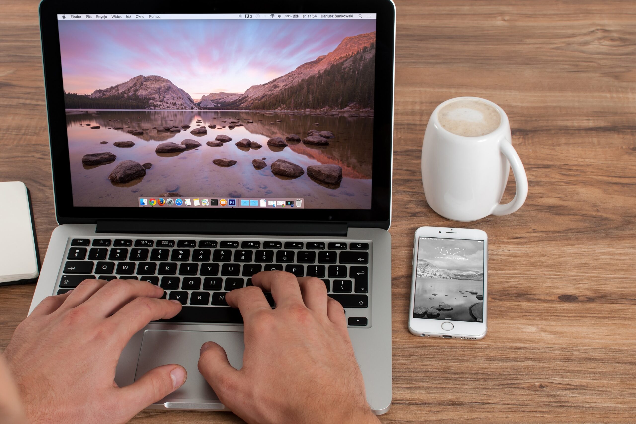 mobile and computer on table feat